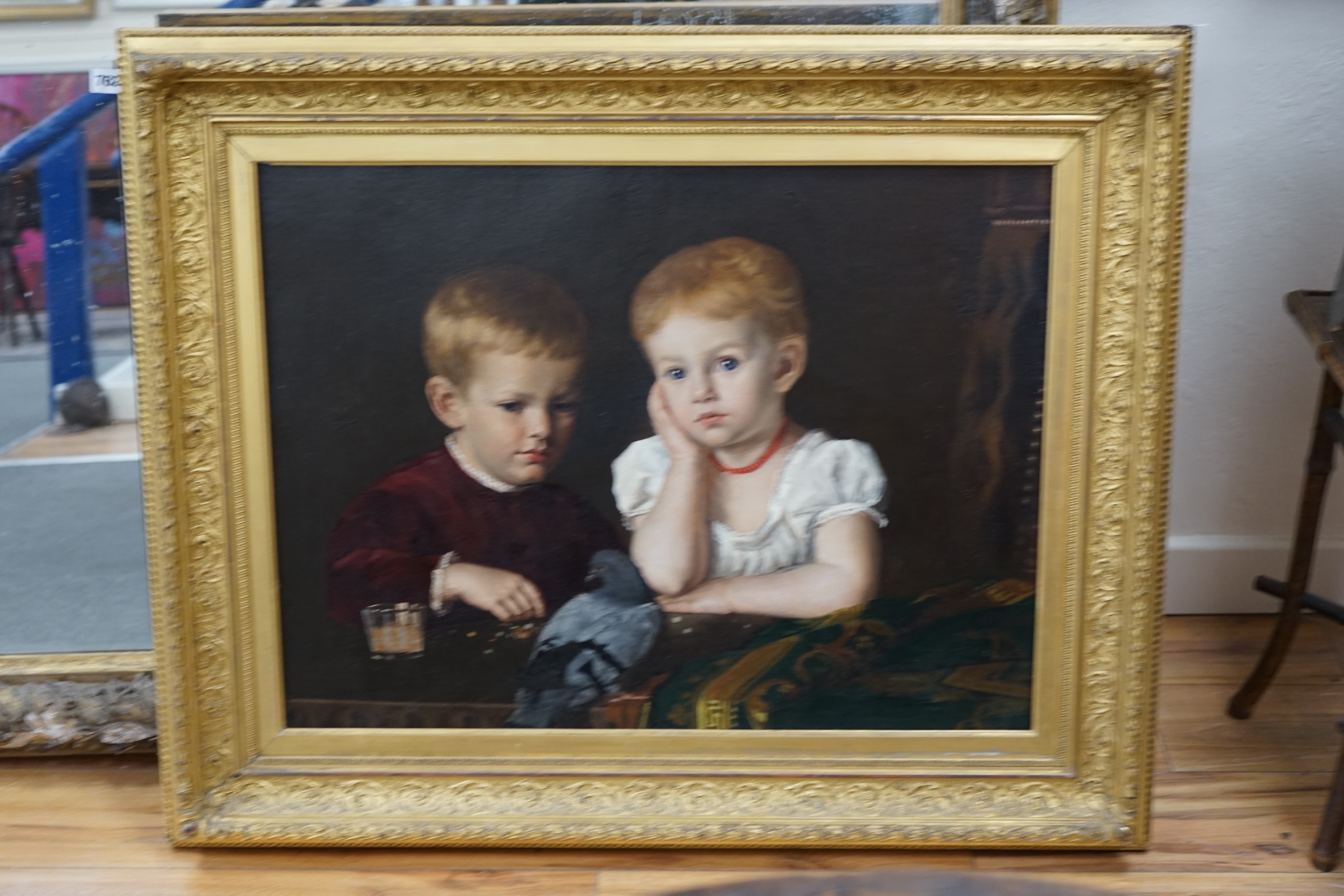 James Sant, R.A. (1820-1916), oil on canvas, Portrait of two boys with a pigeon, 54 x 73cm, gilt framed. Condition - good